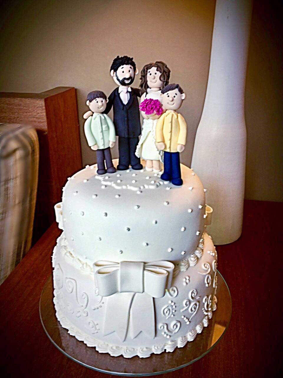 Wedding cake with bride and groom figures in fondant