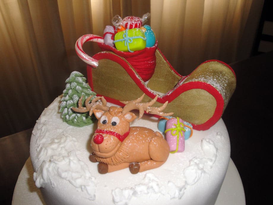 Christmas cake decorated with Santa and reindeer in fondant